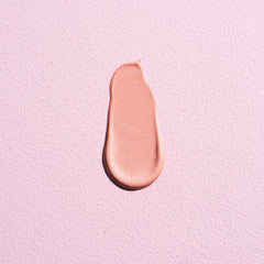W7 Sweet Glow Drops rose tint applied to cheeks for radiant look
