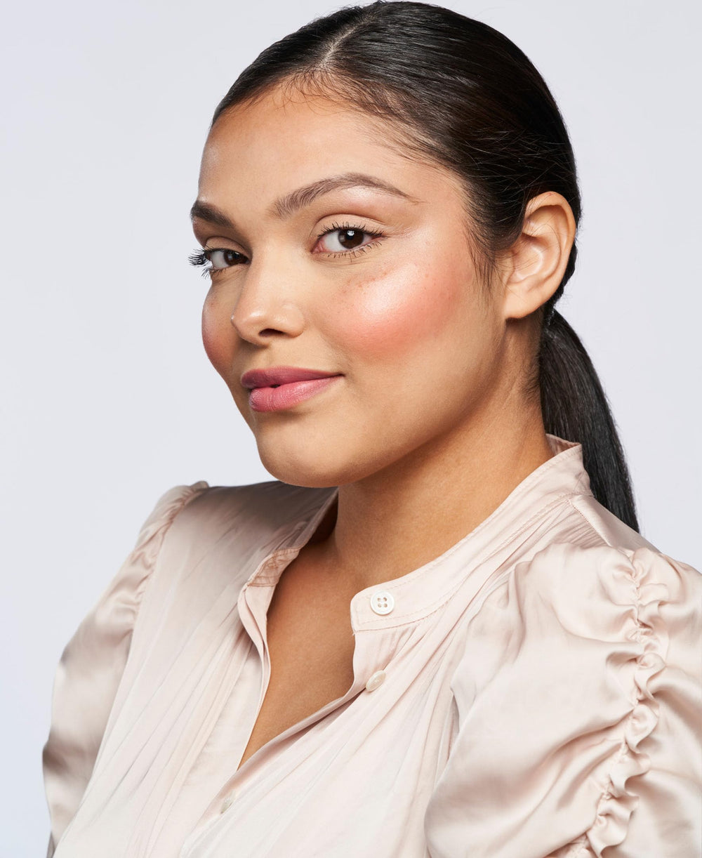 Wander Beauty cream blush stick delivering buildable color to cheeks