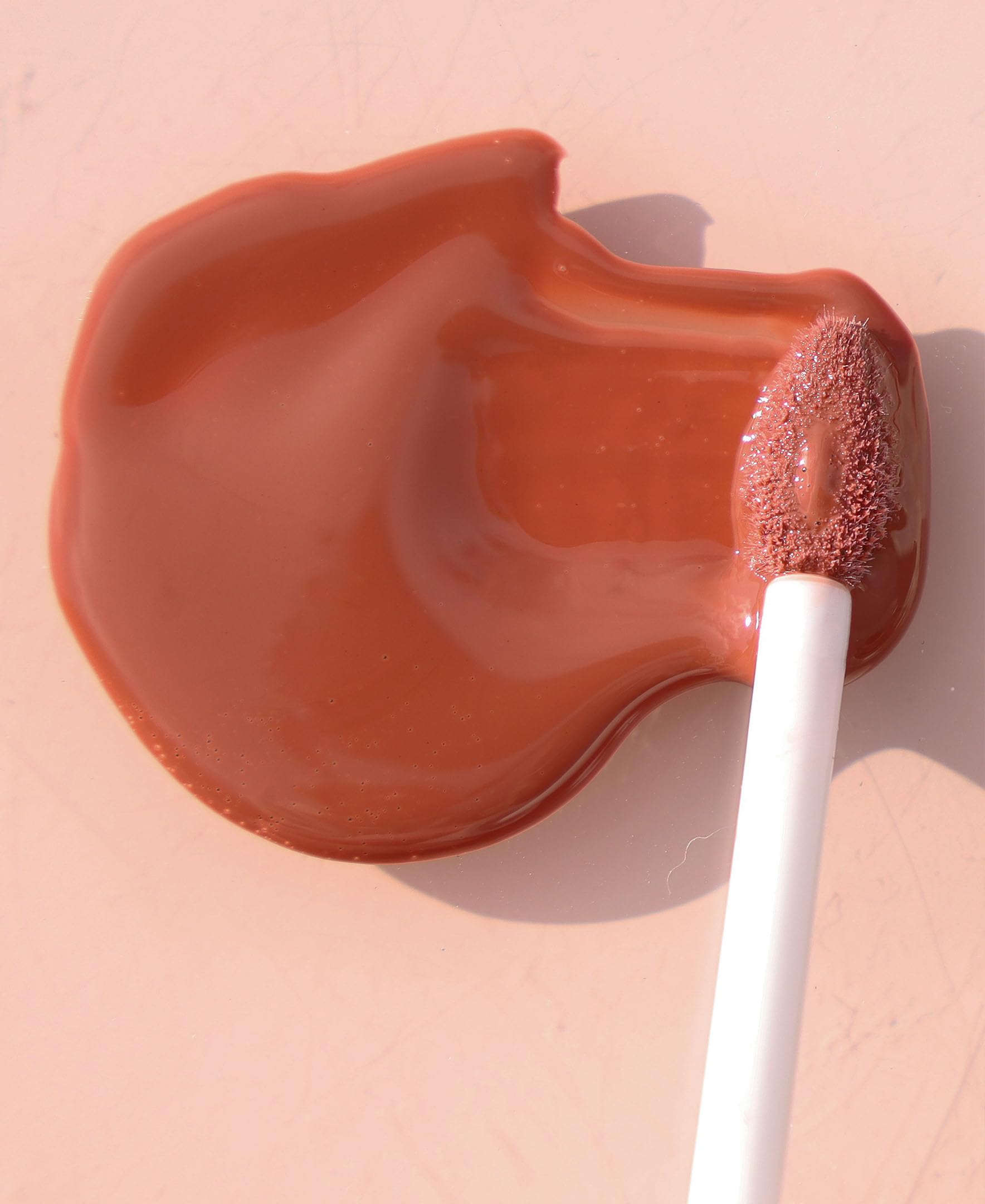 Wander Beauty Lip Retreat Oil Tan Lines swatch reveals mauvey nude everyday color.