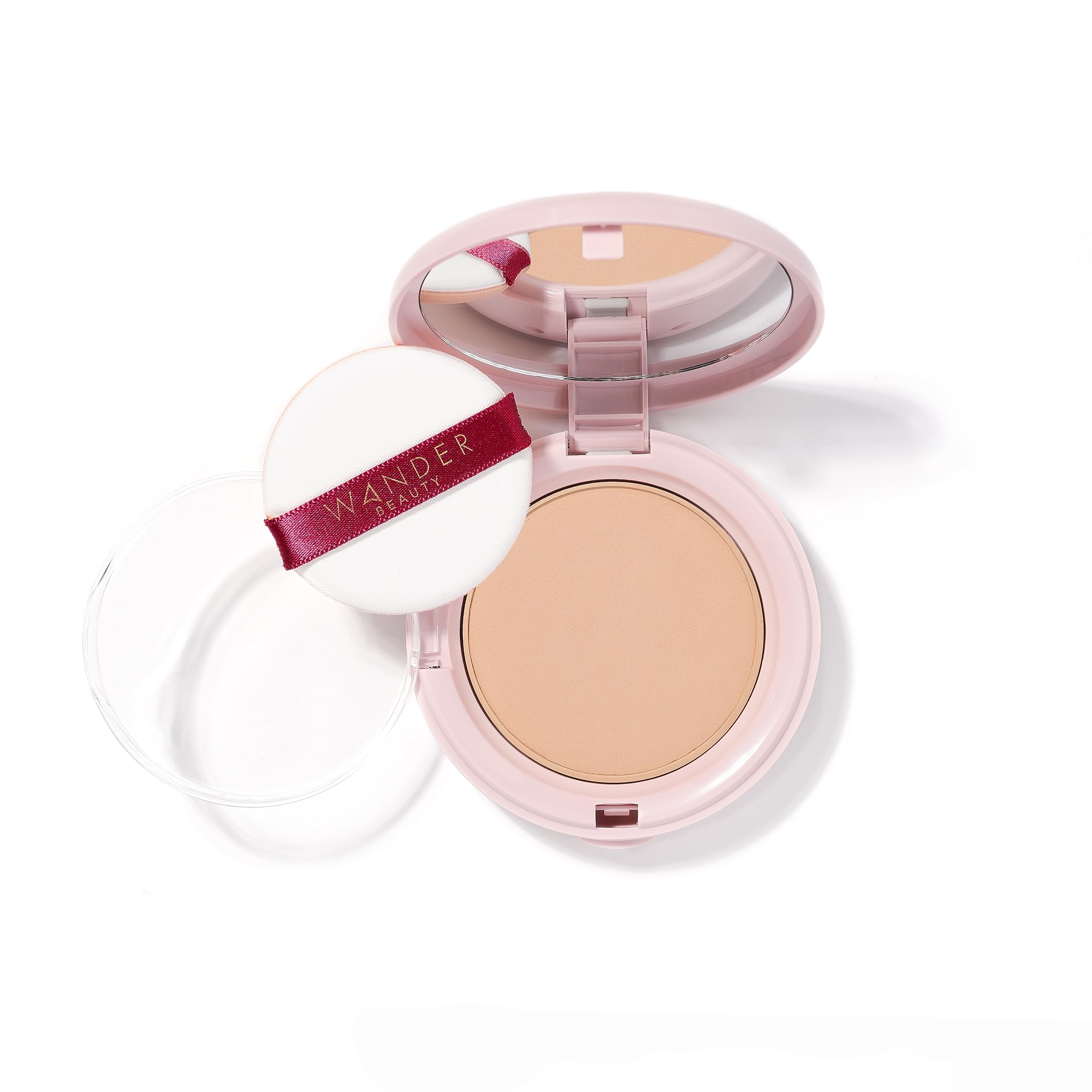 Wander Beauty Wanderlust Powder Foundation Medium blurs skin for a natural finish.