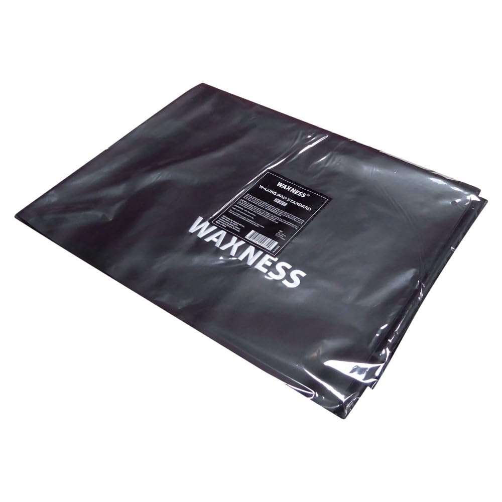 Waxness pad on bed illustrates professional waxing setup with hygienic surface.