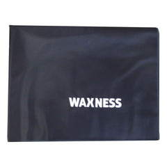 Waxness pad cleaning angle demonstrates easy wipe-down between clients for faster sanitation.