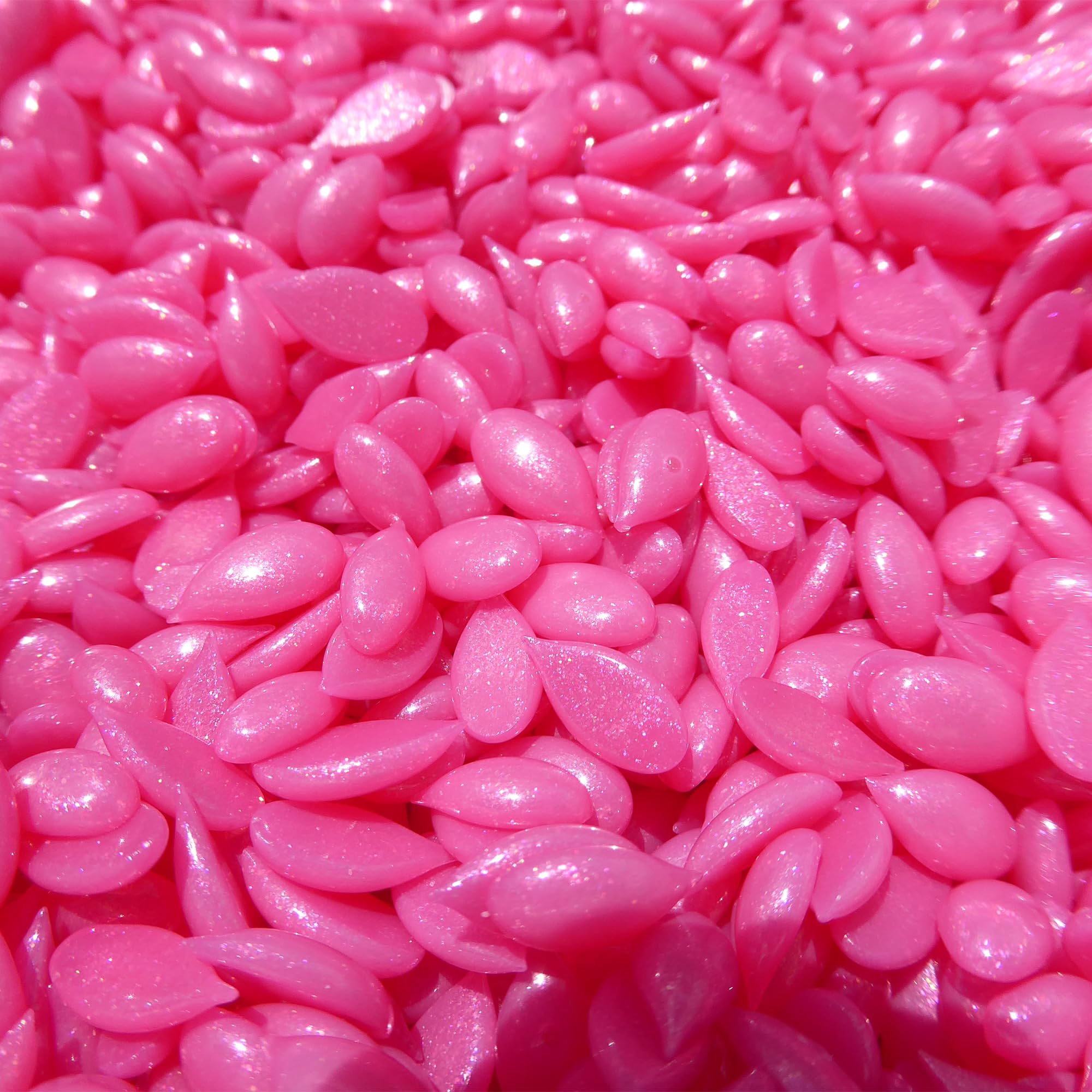 Sparkly pink-magenta Waxness formula highly visible on skin during waxing