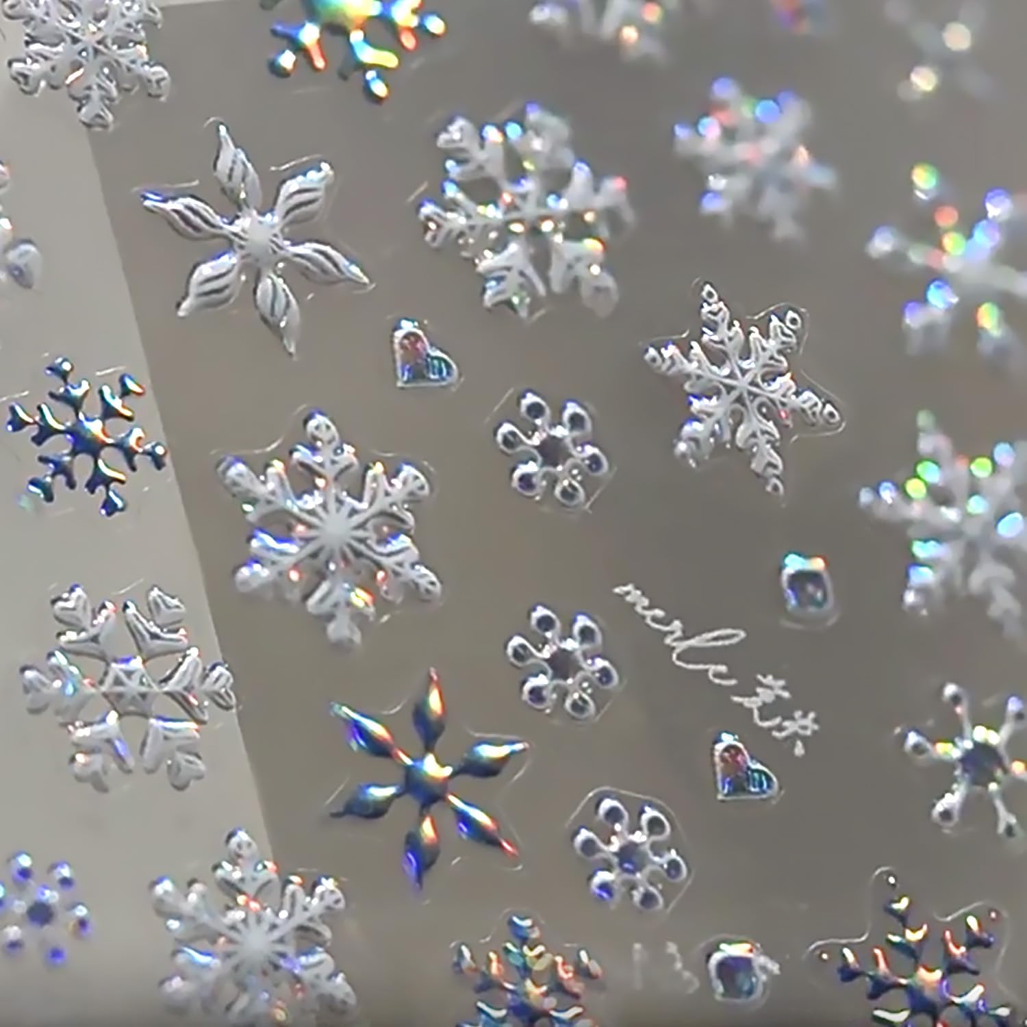 WBRRFJJ 5D embossed Christmas snowflake stickers close-up for festive nails.