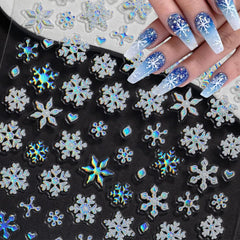 WBRRFJJ holographic blue white snowflakes add shimmer to winter nails.