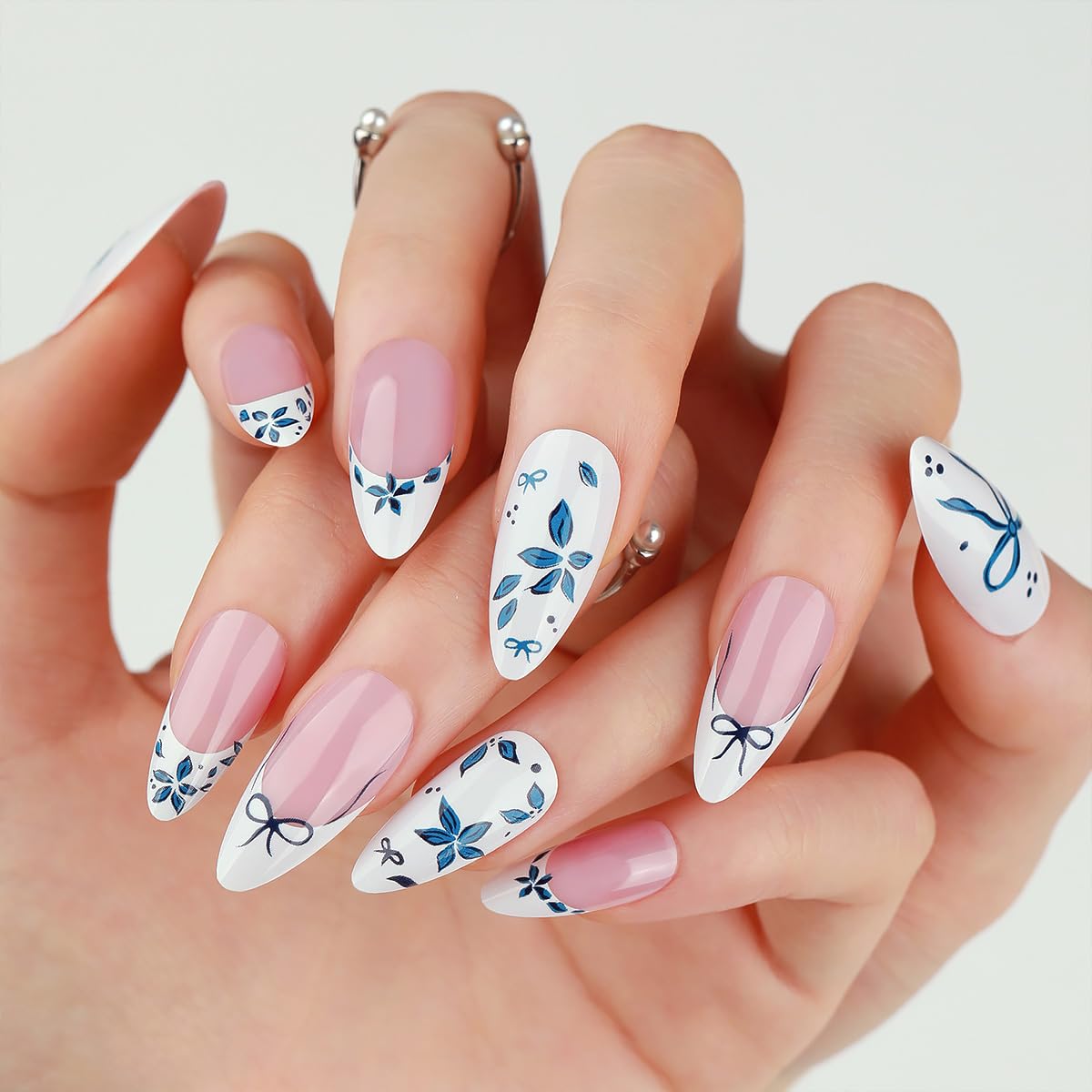 WBRRFJJ glossy blue flower nails with white accents for elegant spring styling.