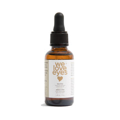 We Love Eyes tea tree eyelid cleansing oil bottle for gentle allergen removal.