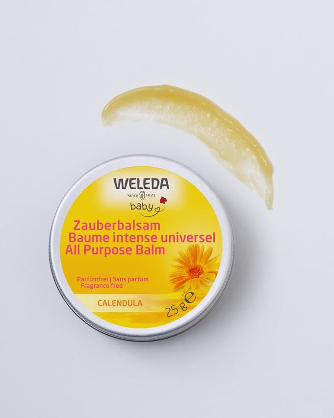 Weleda Baby Calendula Magic Balm on cheek to soothe dry skin