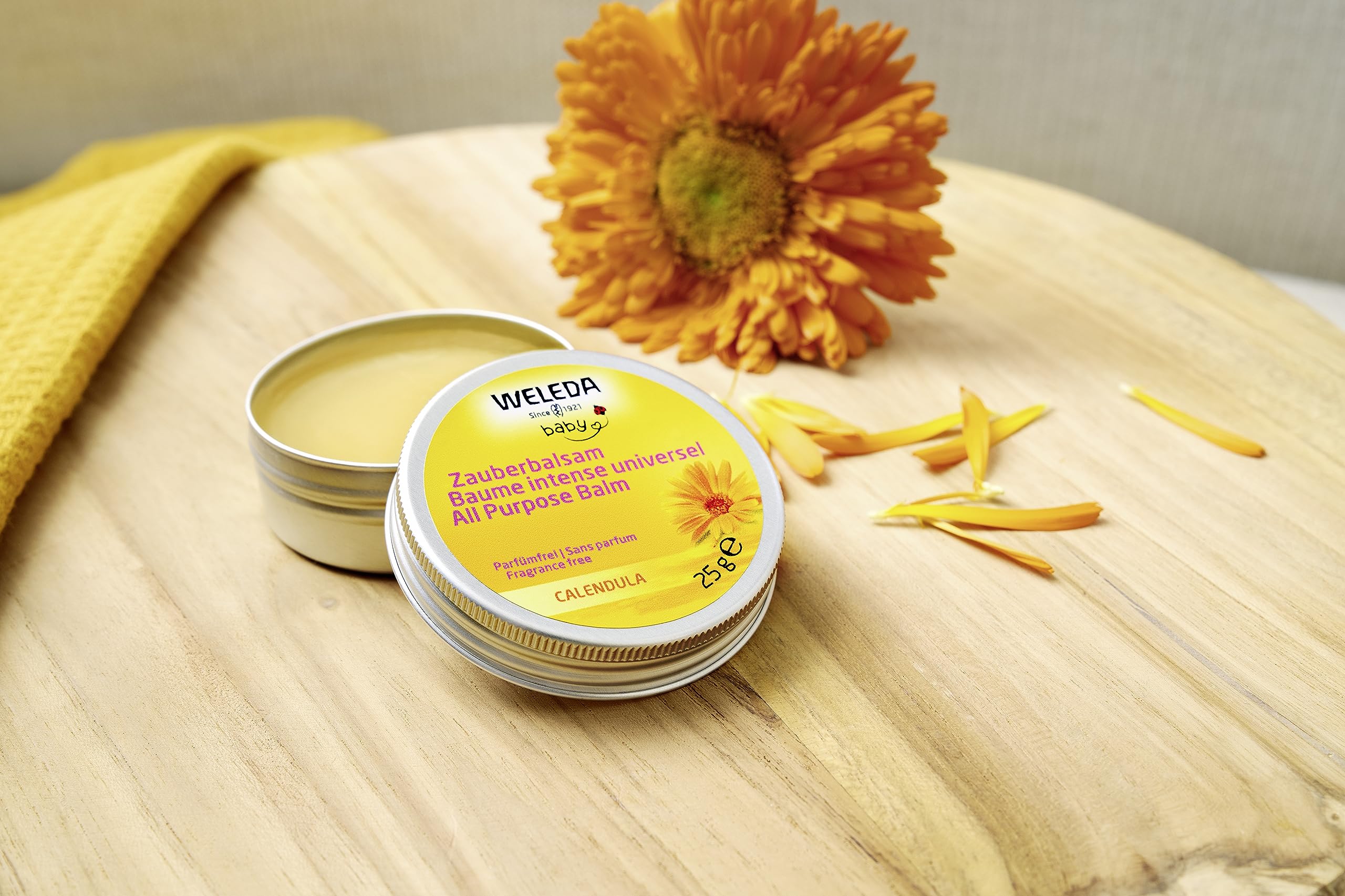 Weleda Baby Calendula Magic Balm on hands for dry skin relief