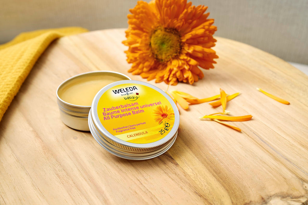 Weleda Baby Calendula Magic Balm on hands for dry skin relief