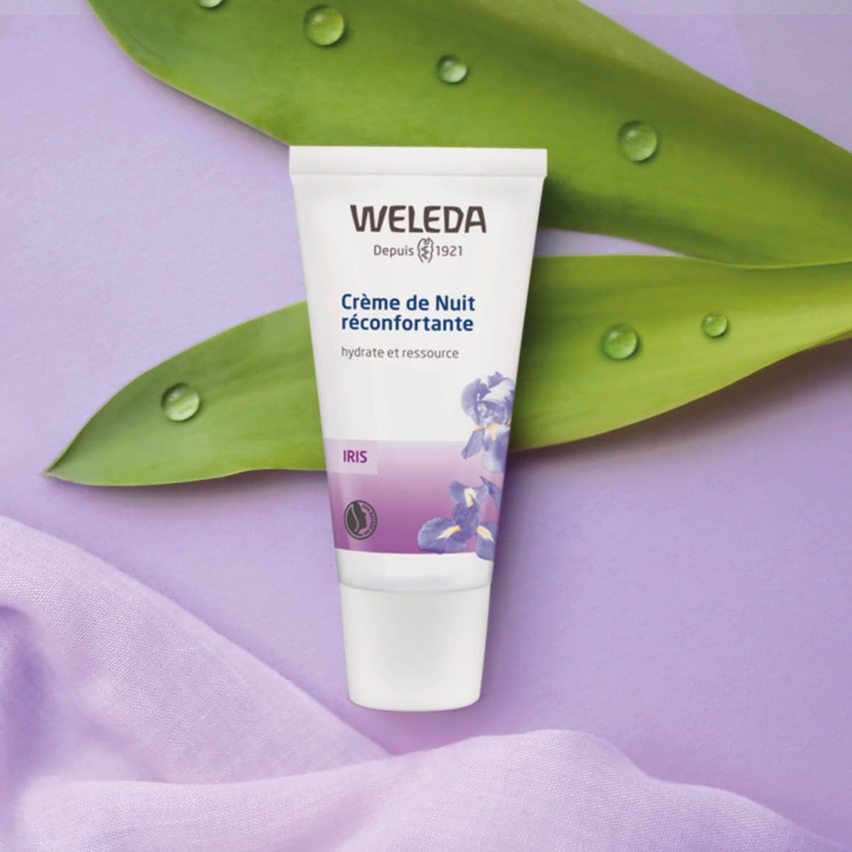 Person applies the night cream as part of a nightly skincare routine.