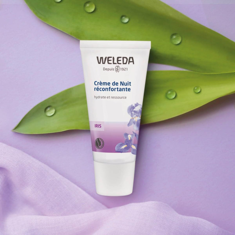 Person applies the night cream as part of a nightly skincare routine.