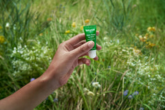 Applying Weleda Lip Butter on lips for easy nourishment