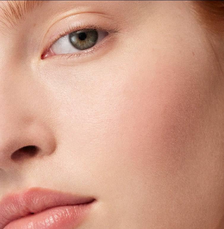Swatch of Westman Atelier Coquette pinky peach blush on skin