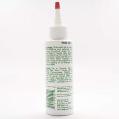 Wild Growth Hair Oil applied to hair to aid detangling and softness.