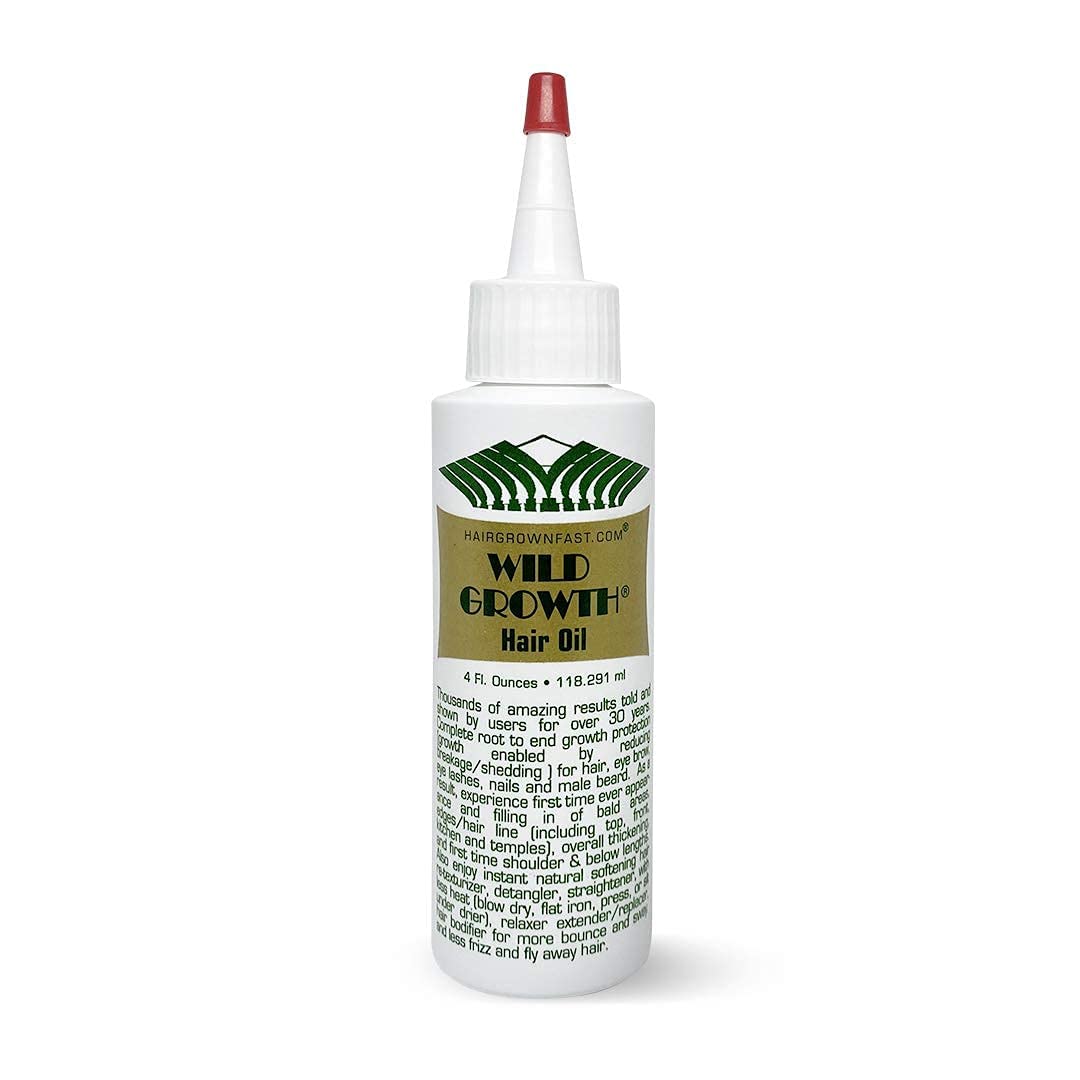 Wild Growth Hair Oil bottle pour demonstrates rich hydration for softer hair.