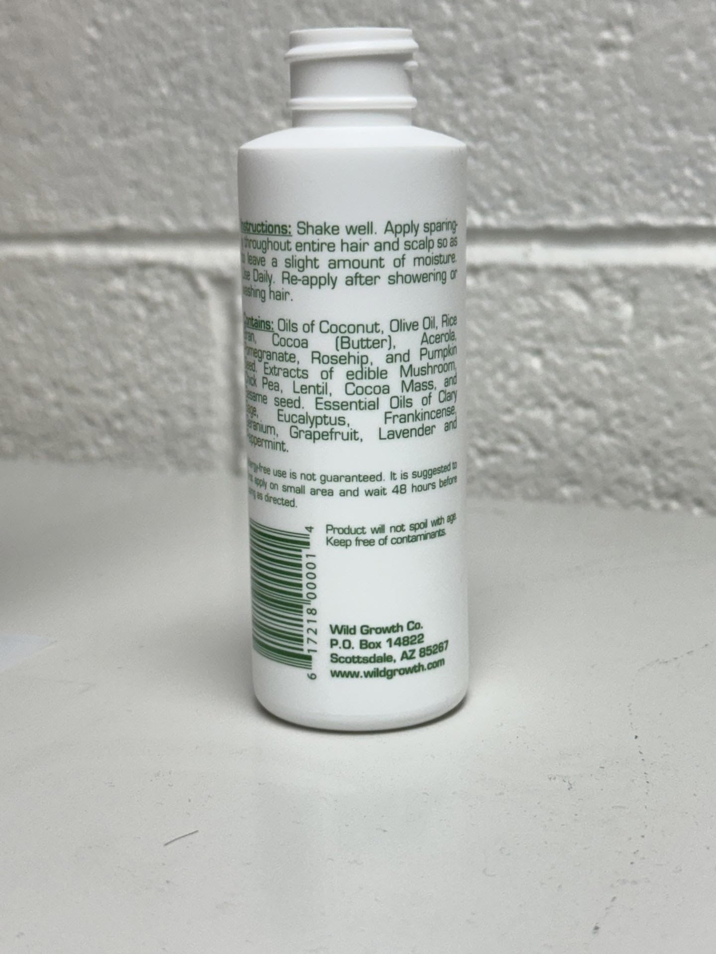 Wild Growth Hair Oil packshot highlights concentrated formula for all hair types.