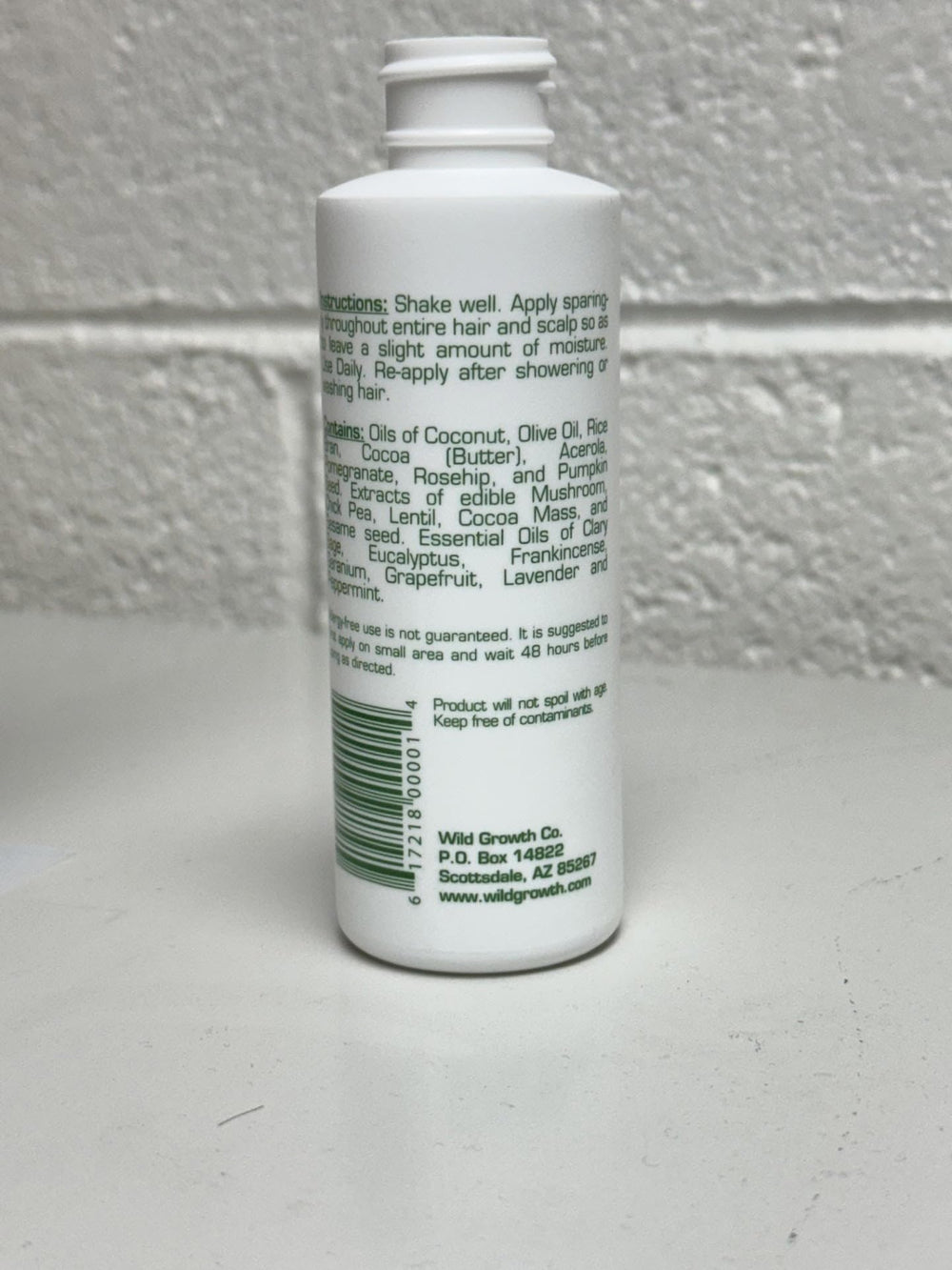 Wild Growth Hair Oil packshot highlights concentrated formula for all hair types.