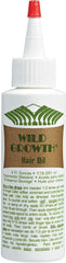 Wild Growth Virgin Hair Fertilizer being applied to the scalp for growth support.