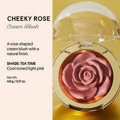 Winky Lux Cheeky Rose Cream Blush swirled on finger, showing smooth, blendable texture.