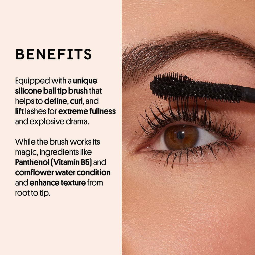 Winky Lux ExtravaLash Mascara wand in action demonstrates buildable length and curl.