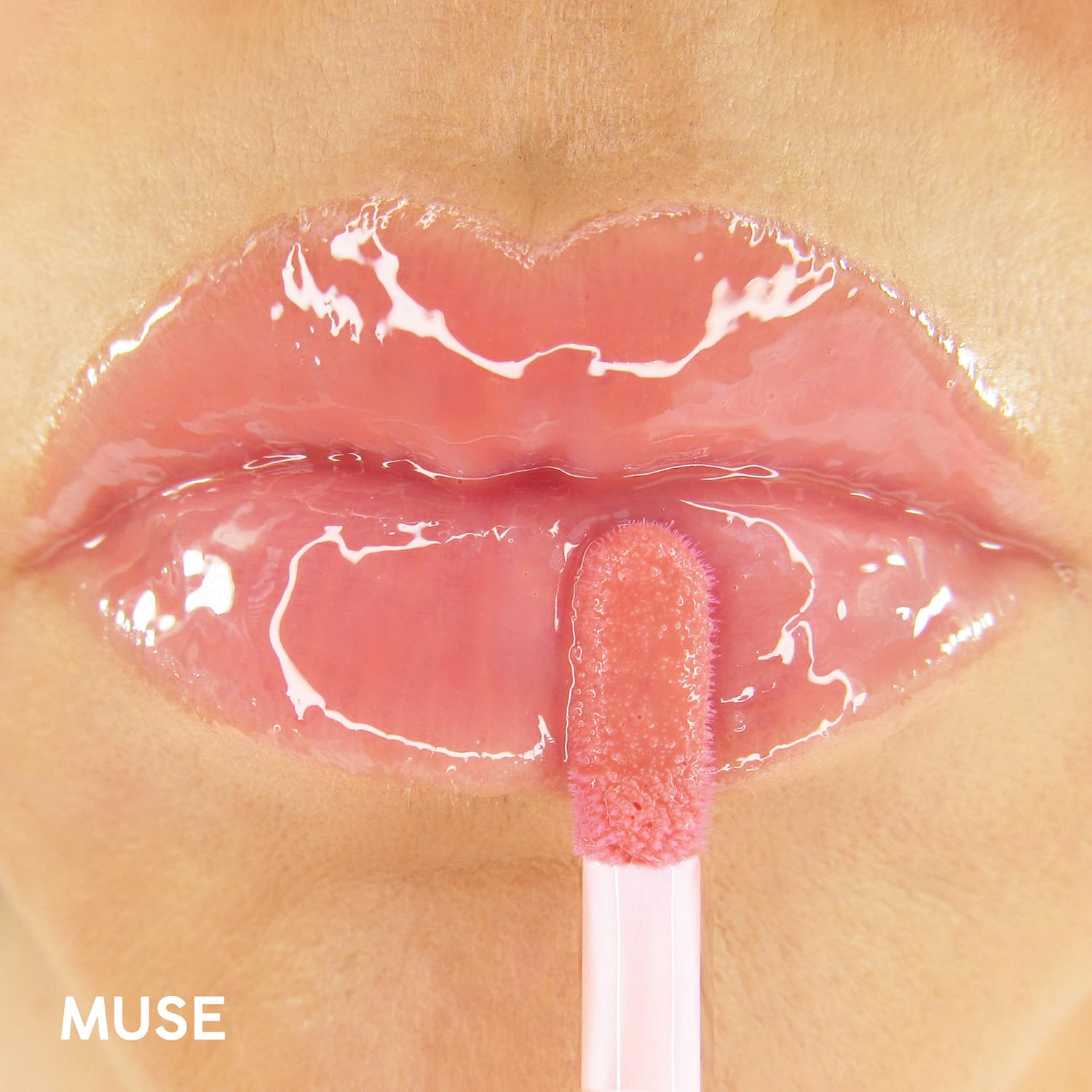 Winky Lux Muse lip oil application tube ready for on-the-go hydration and color.