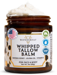 Wonderfat grass-fed whipped tallow balm on face for deep hydration.