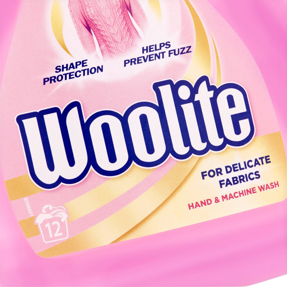 Woolite Hand Wash soft-lather close-up on fabric texture.