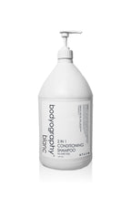 World Amenities Bodyography Blanc 2-in-1 shampoo bottle for smooth, frizz-free hair on the go.