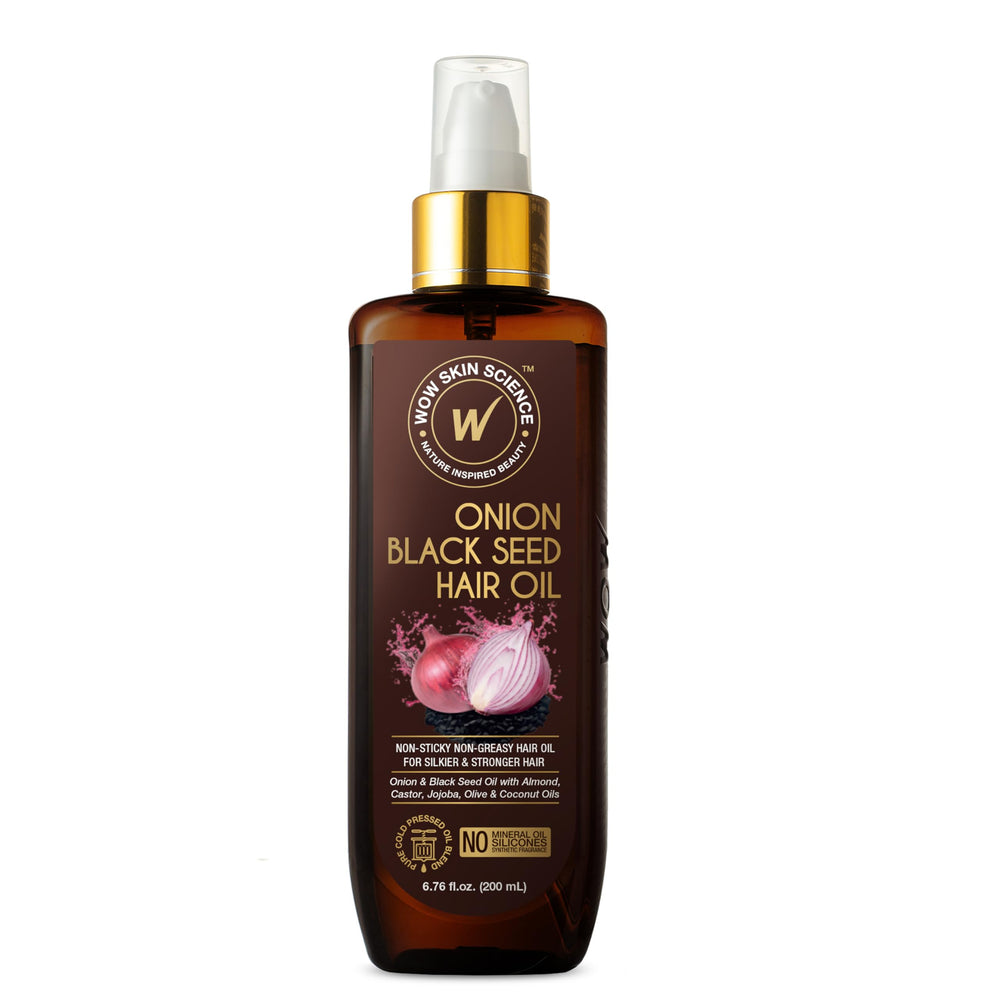 WOW Skin Science Onion Black Seed Hair Oil bottle closeup showing nourishing shine benefits