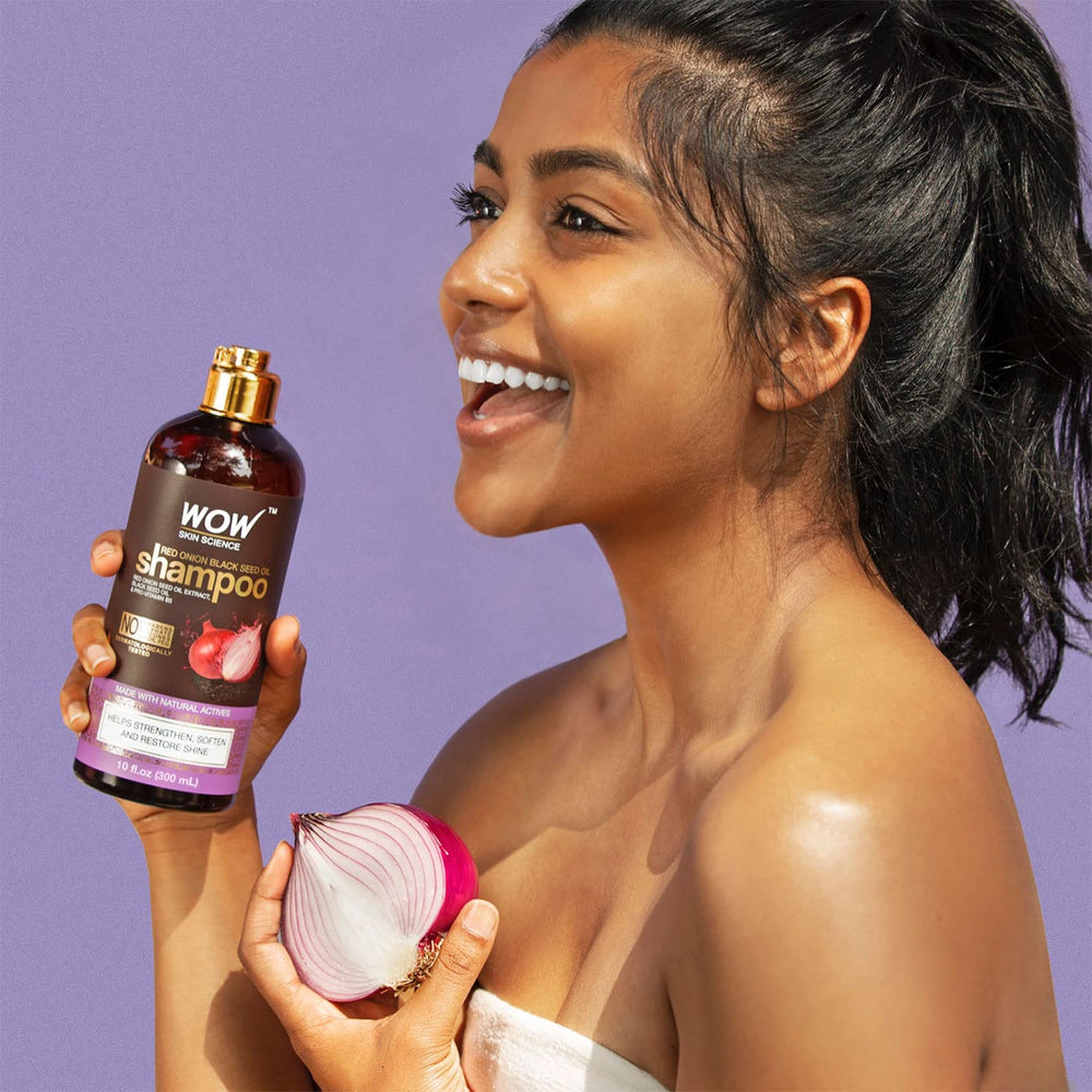 Shampoo bottle highlights clarifying action to remove buildup.
