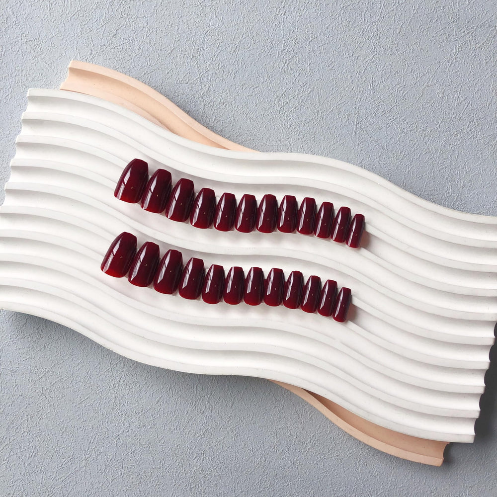 XCREANDO Burgundy Red Short Coffin Nails styled for a fashion-forward look