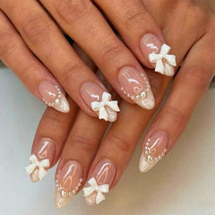 Xenophoer white French tip almond nails set with pink glossy finish for salon-like results.