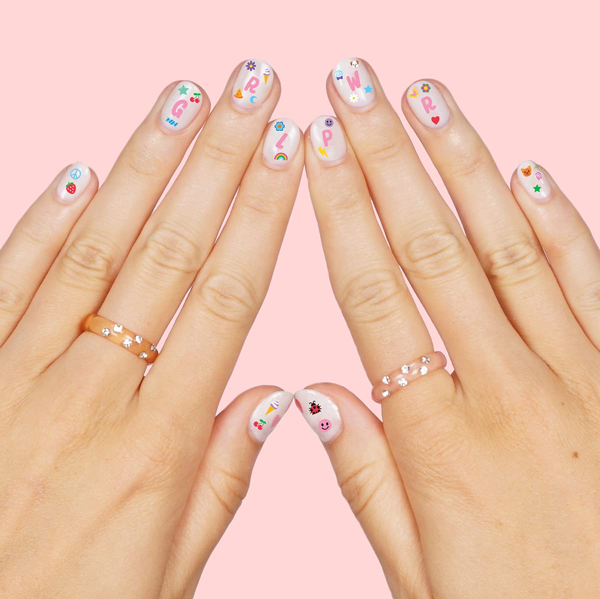 xo Fetti designs featuring rainbows and flowers for colorful manicures