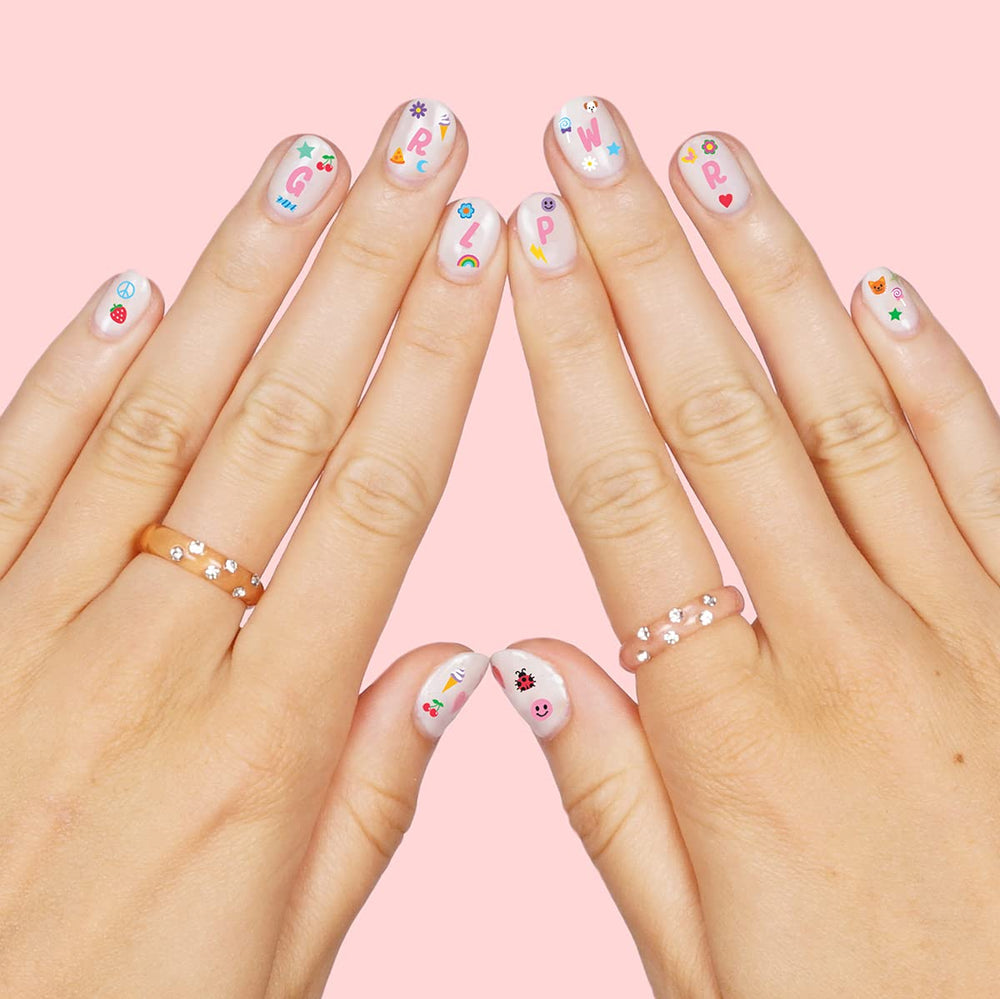 xo Fetti designs featuring rainbows and flowers for colorful manicures