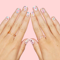 xo Fetti designs featuring rainbows and flowers for colorful manicures