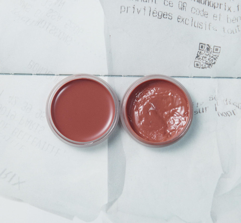 Close-up texture of XOUL lip balm shows smooth glide for daily use.