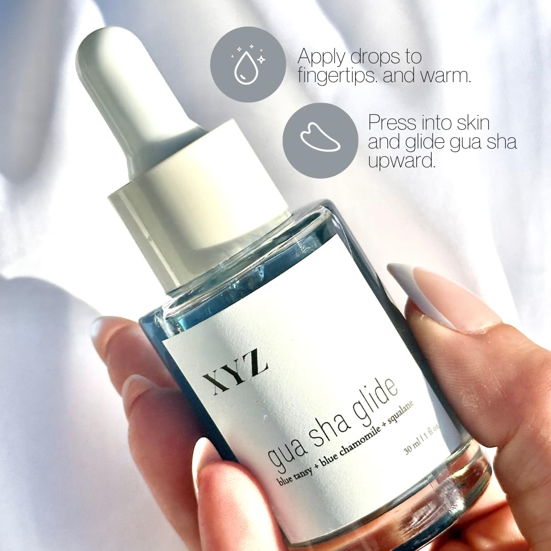 XYZ Skin Gua Sha Glide close-up of blue-tinted oil texture