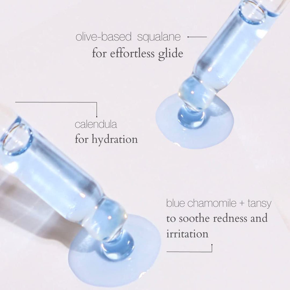 XYZ Skin Gua Sha Glide bottle beside gua sha tool for massage-ready hydration