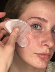 XYZ Skin Gua Sha Glide dropper dispensing blue-tansy serum for hydration