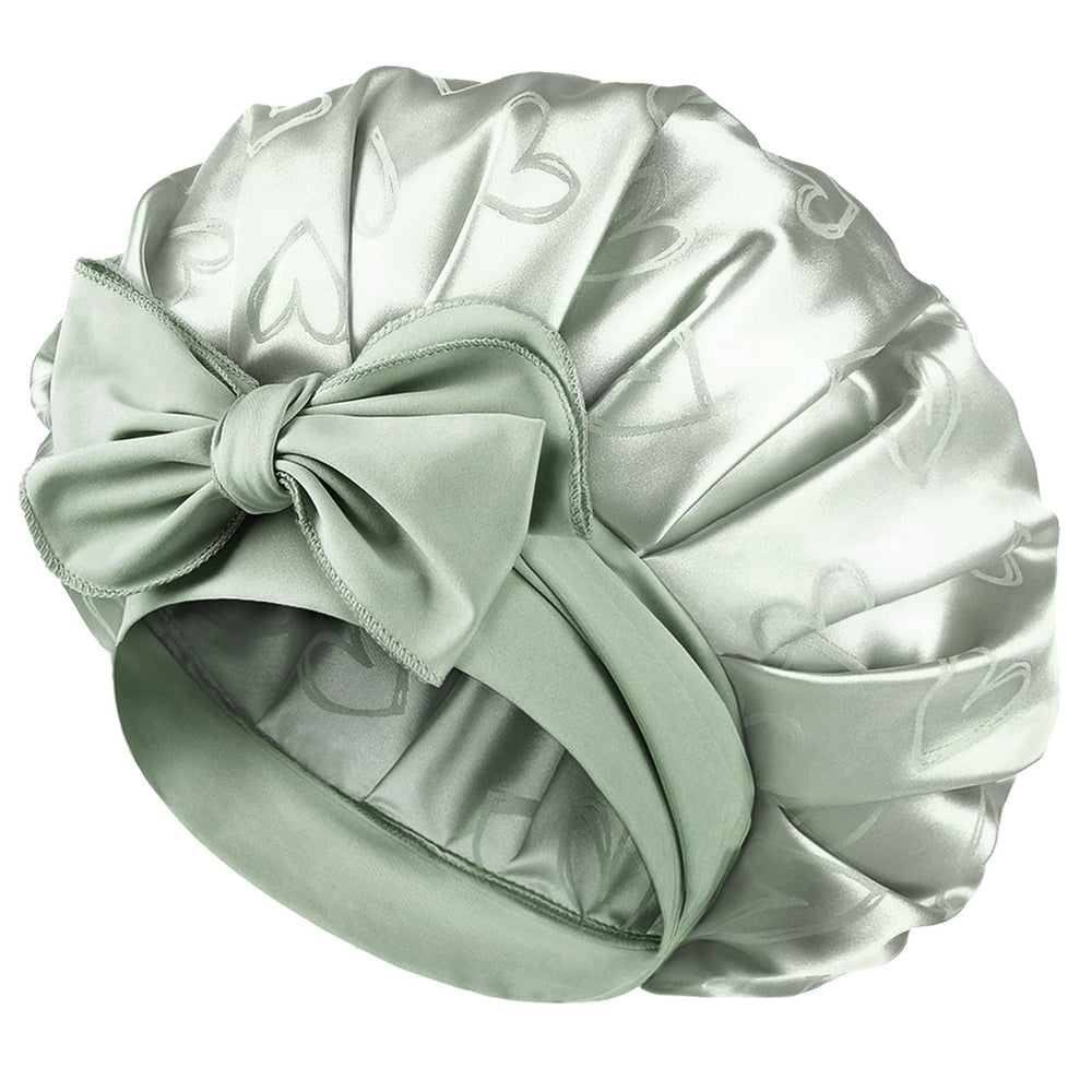 YANIBEST adjustable satin bonnet in green showing secure overnight fit for curls