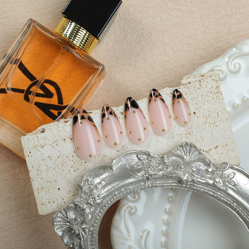 YEFIUO leopard French almond nails with gold beads for chic looks