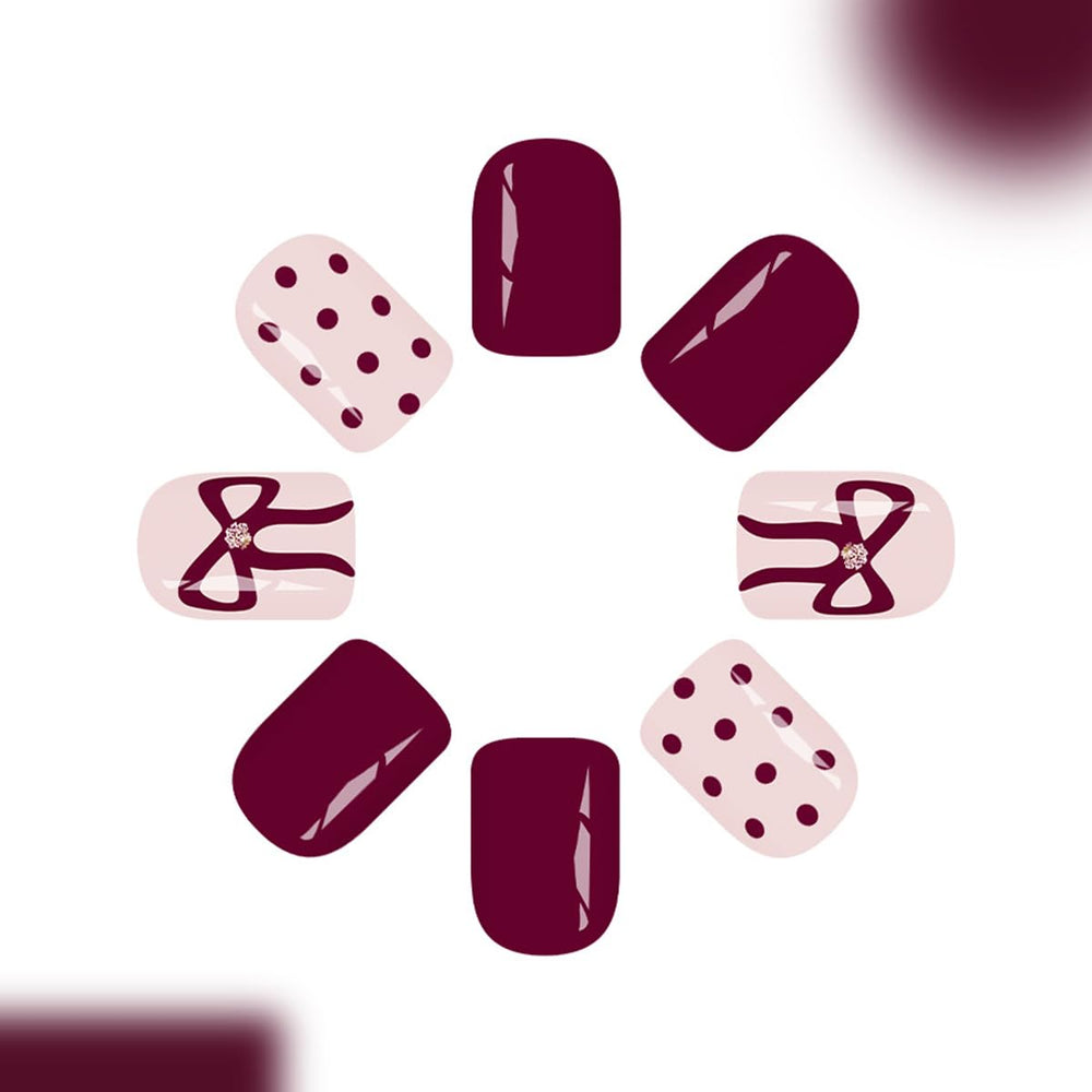 YEFIUO wine red polka dot bow nails closeup with glossy finish.