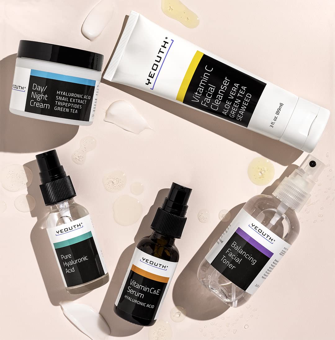 YEOUTH Complete routine display with cleanser, toner, serums, and cream.