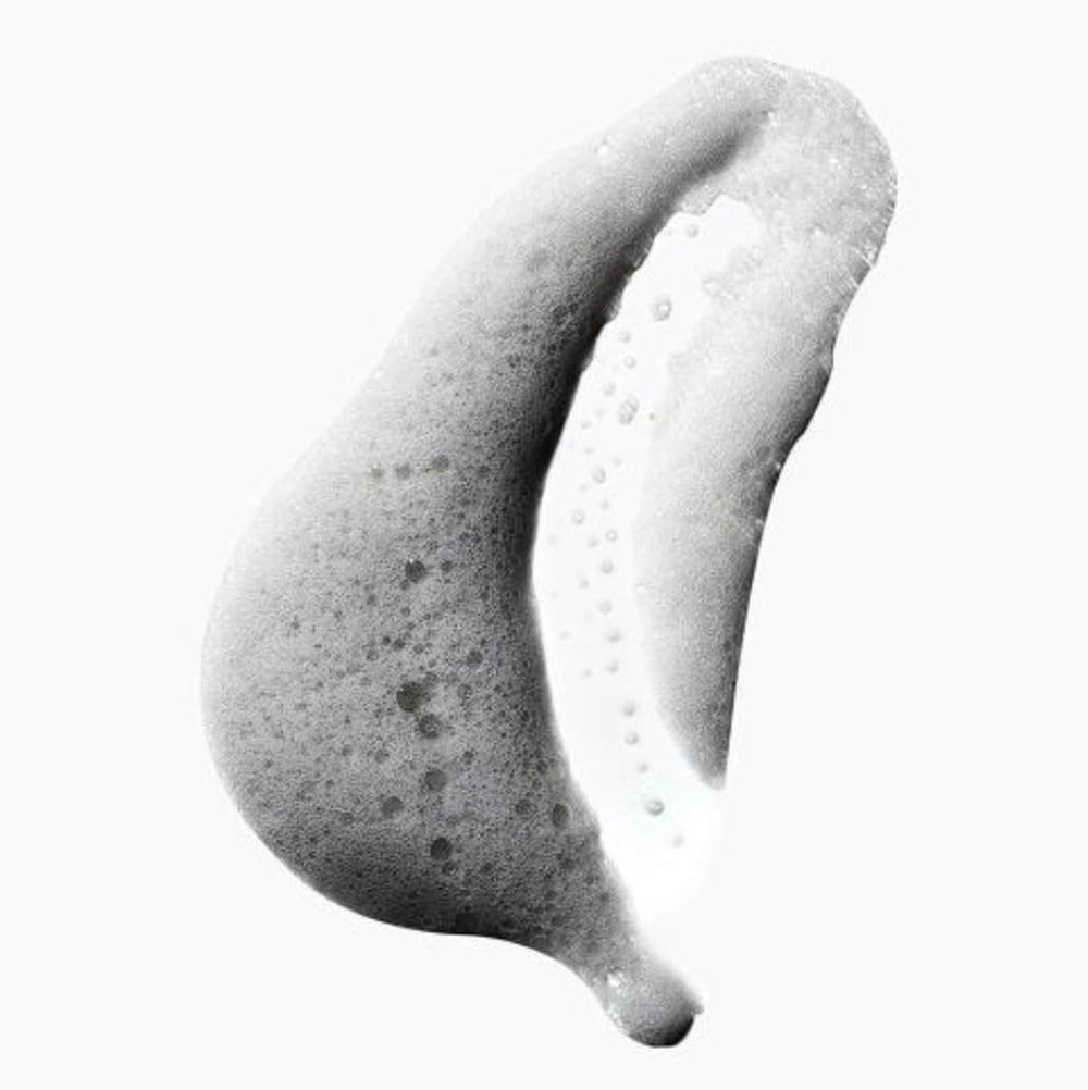 Yes To Tomatoes oxygenated foam closeup highlights airy lather that lifts impurities from pores.