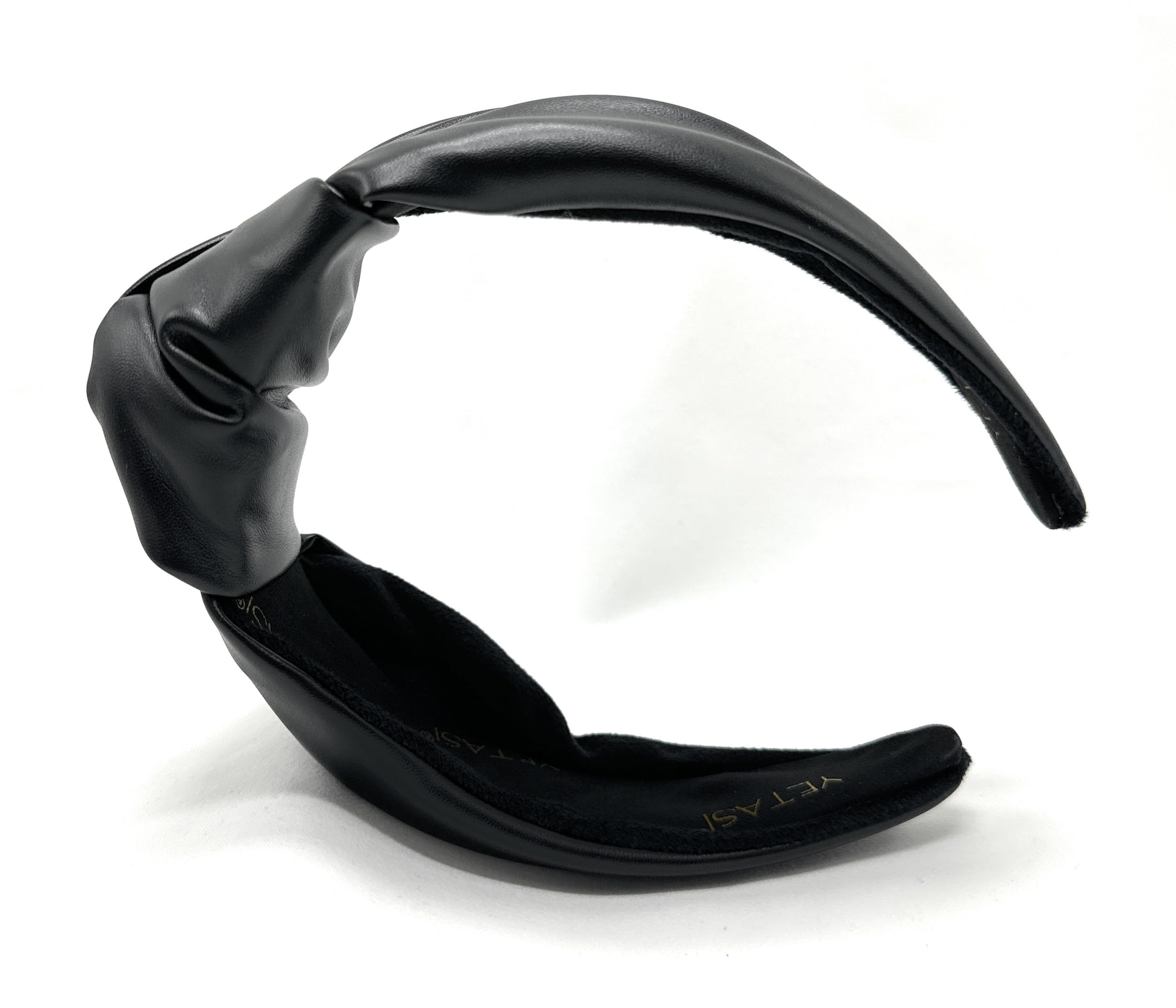 Yetasi top knot headband travels easily in a bag for quick hair fixes.