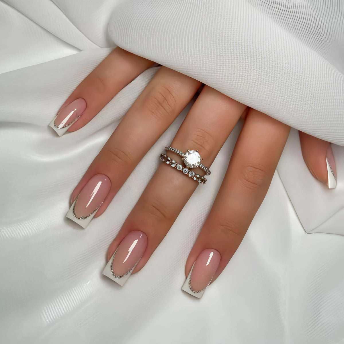 YIYILEIC French medium press-on nails in nude gloss with white border for elegant everyday wear.