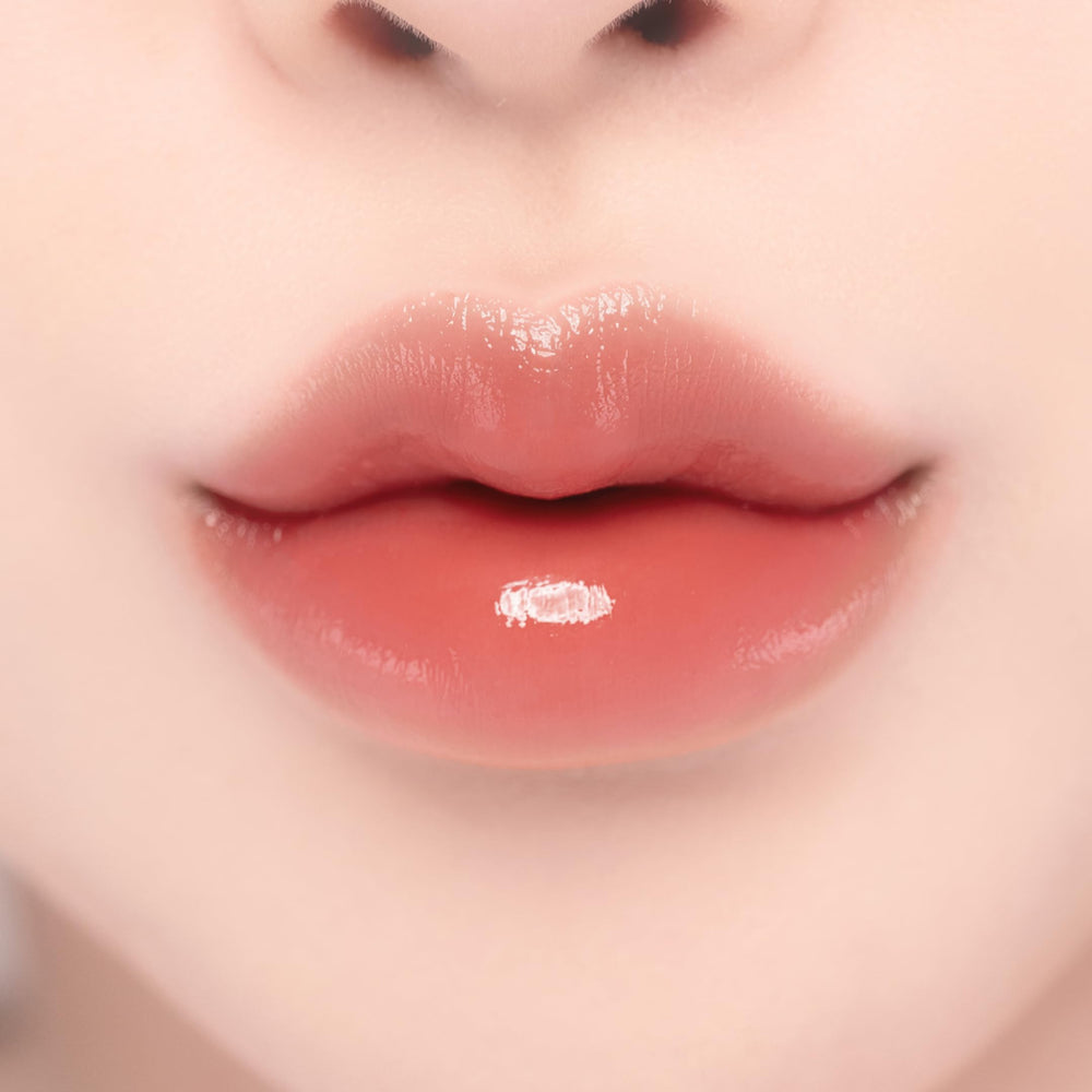 YNM Candy Gloss Balm lip gloss swatch showing glossy finish on lips.