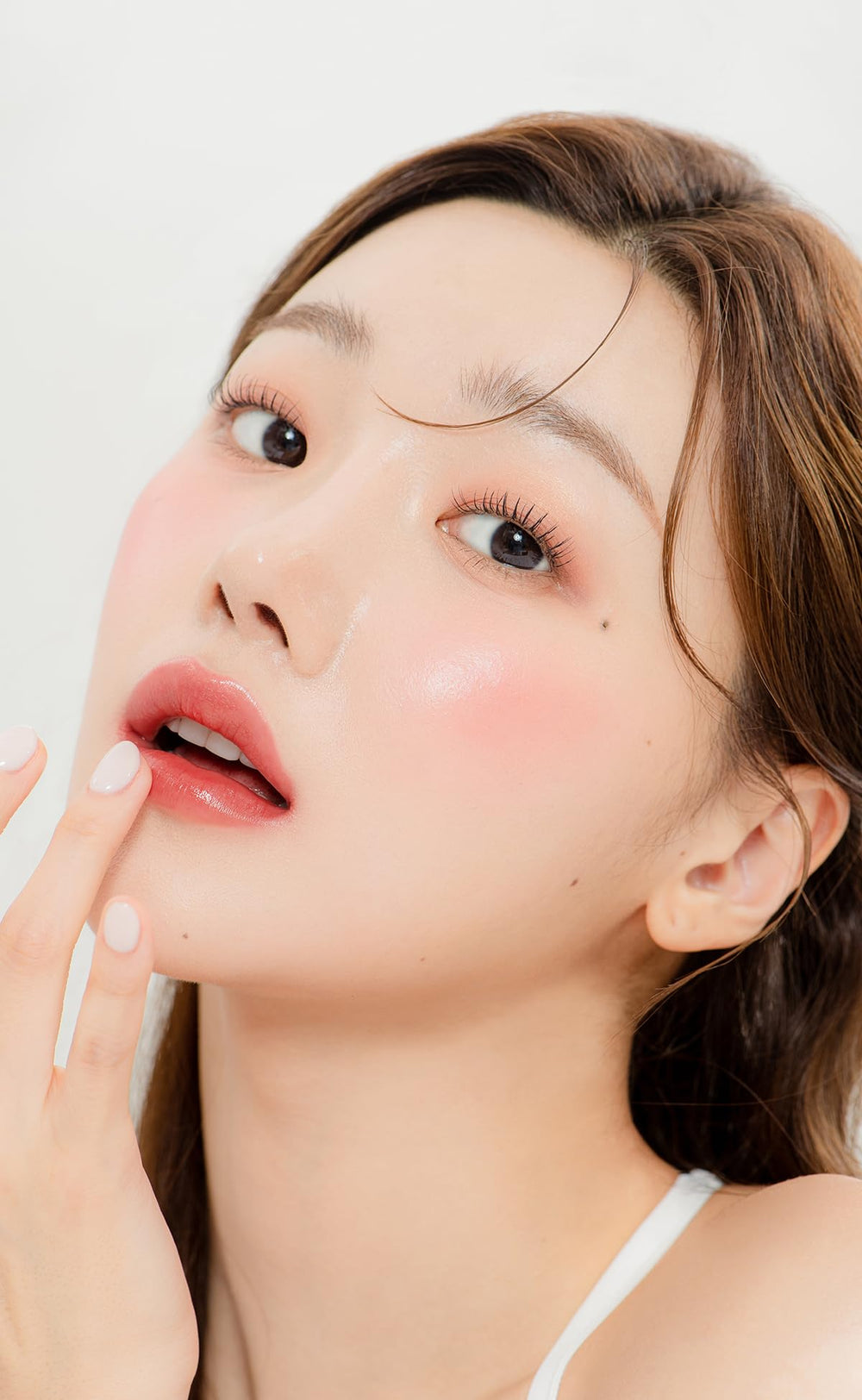 Mango seed butter and squalane in YNM Candy Gloss Balm for lasting moisture.