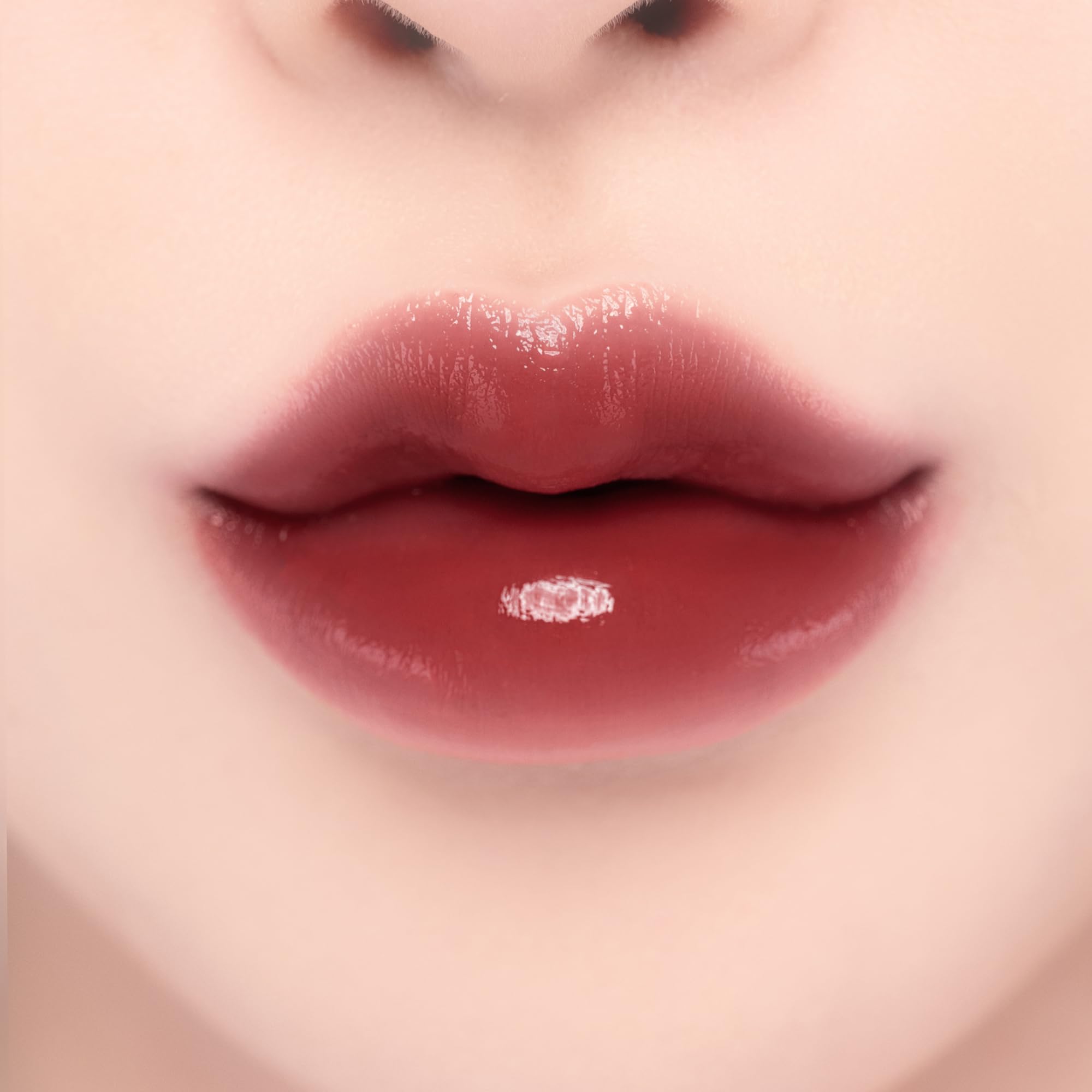 YNM Candy Gloss Balm color swatch on skin demonstrates buildable shade.